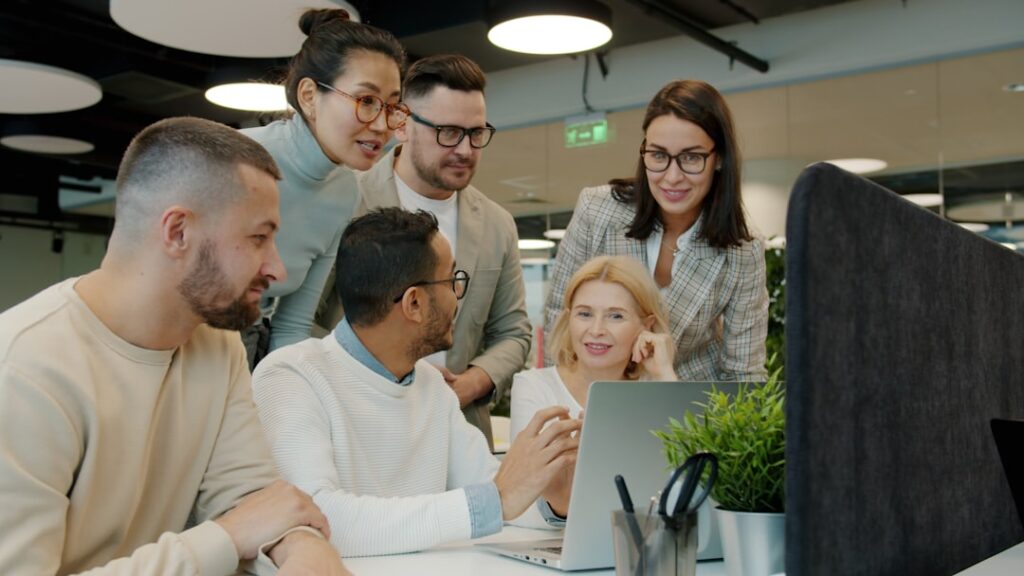 Business team collaborating on Odoo ERP software in a modern office